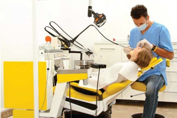 dentist examining a patient's mouth