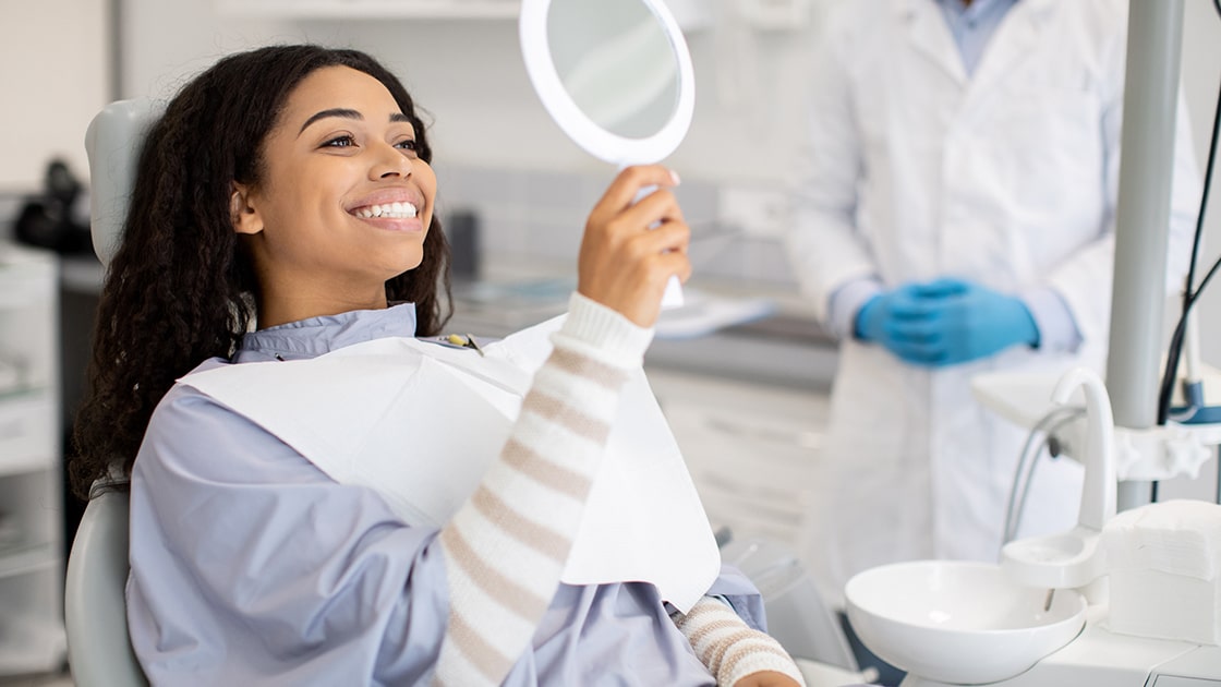 Smiling Woman in Dental Chair