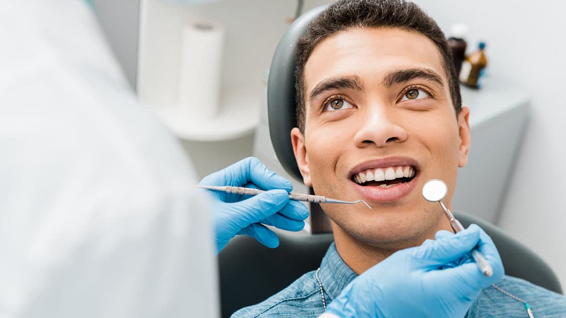 Smiling Man in Dental Chair