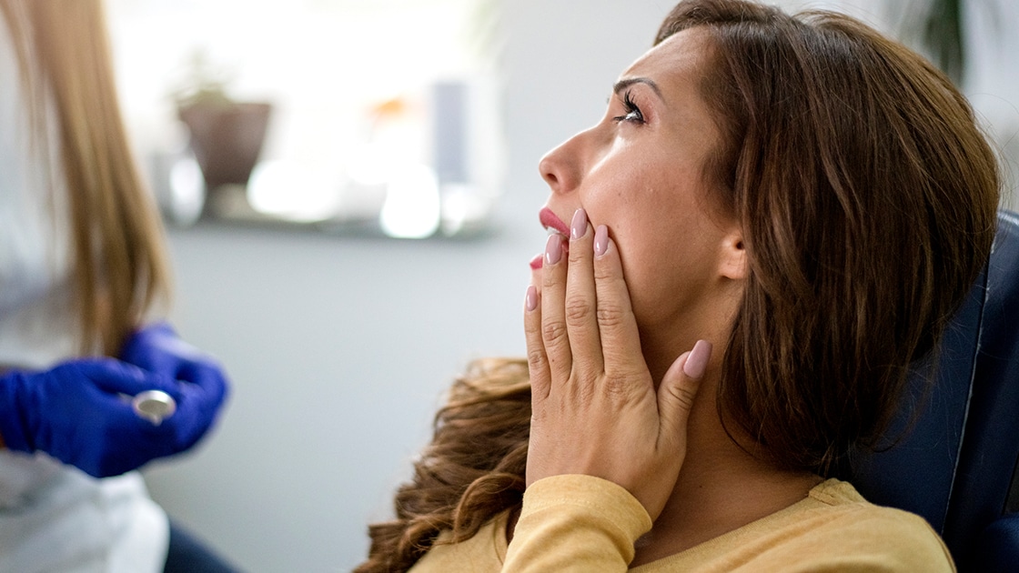 Woman Talking to Dentist