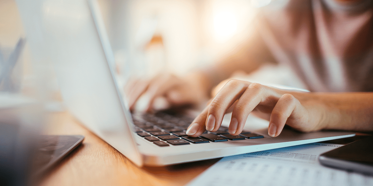 Woman Typing on Computer