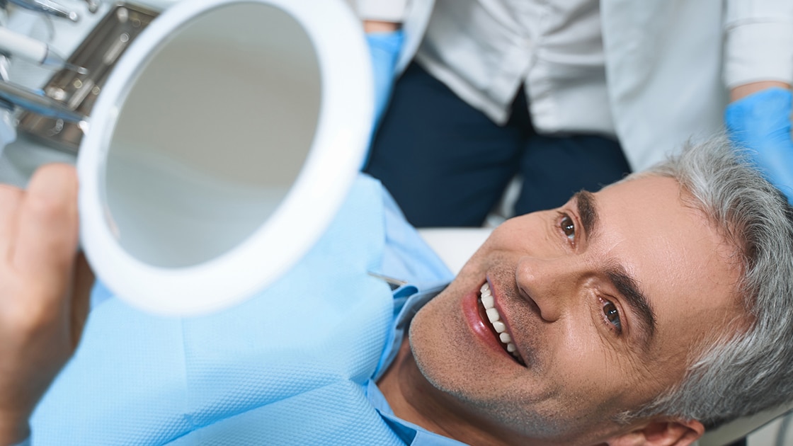 Man Smiling in Mirror