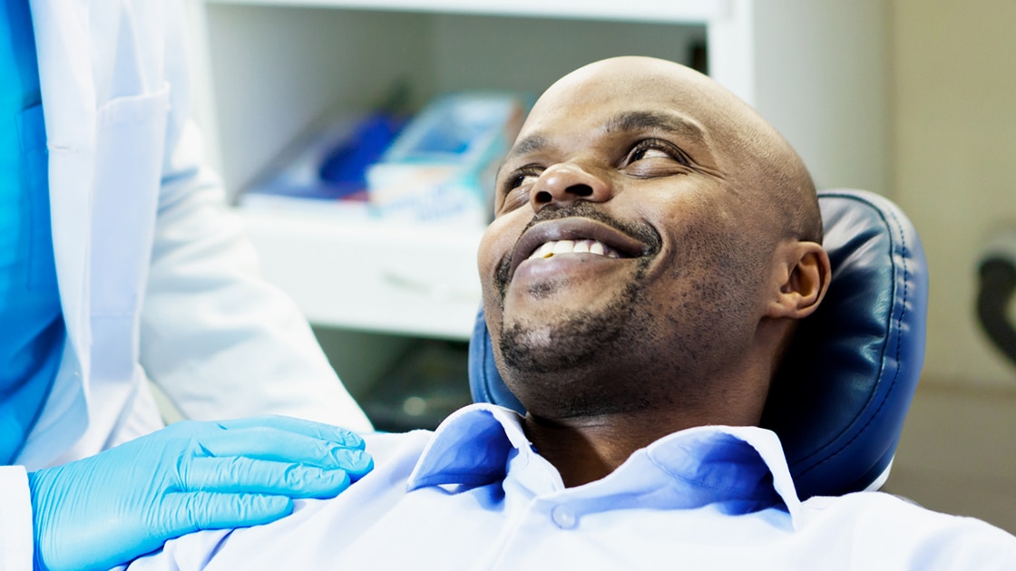 Man being reassured by doctor