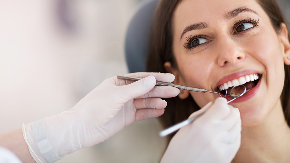 Smilng woman at dentist